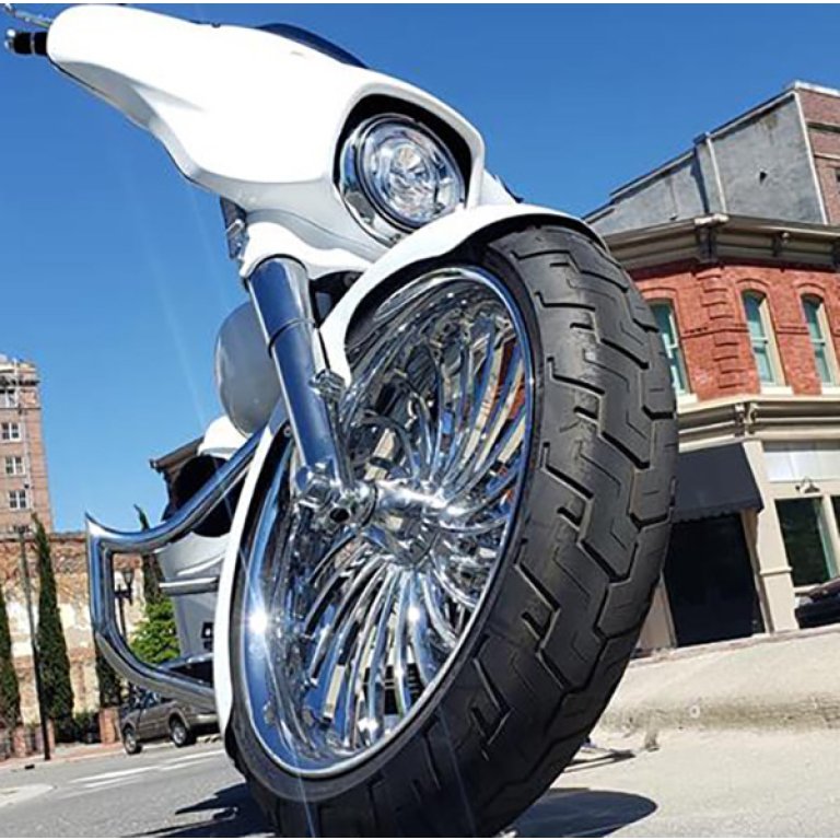 Harley with 23x5.5 Volt Chrome fat tire wheel, Woods Cycles build